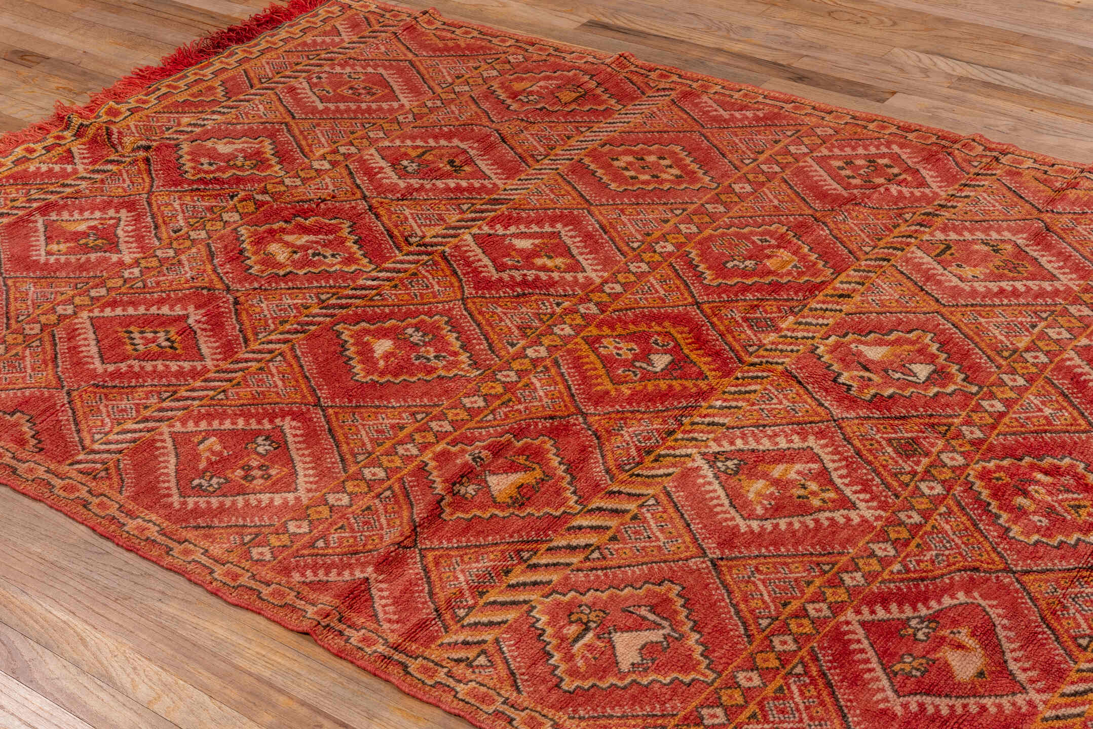 5' x 8' one-of-a-kind handmade vintage Moroccan medium size rug. Color palette: brown, pink, red, orange, dark red, peru
