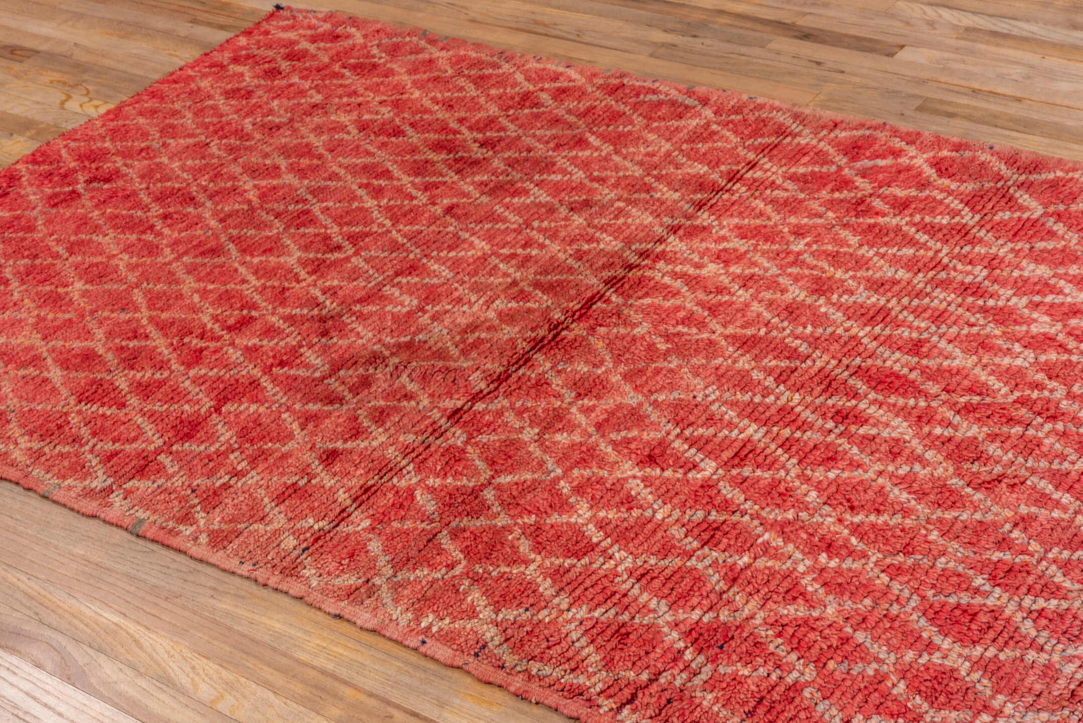 4' x 8' one-of-a-kind handmade vintage Moroccan rug. Color palette: brown, red, pink, fire brick