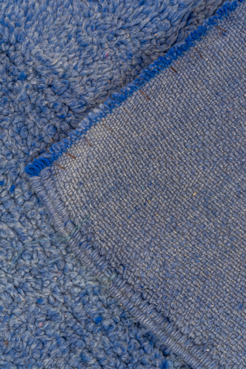 7' x 9' one-of-a-kind handmade vintage Moroccan rug. Color palette: blue, gray, light blue, fiord, light steel blue