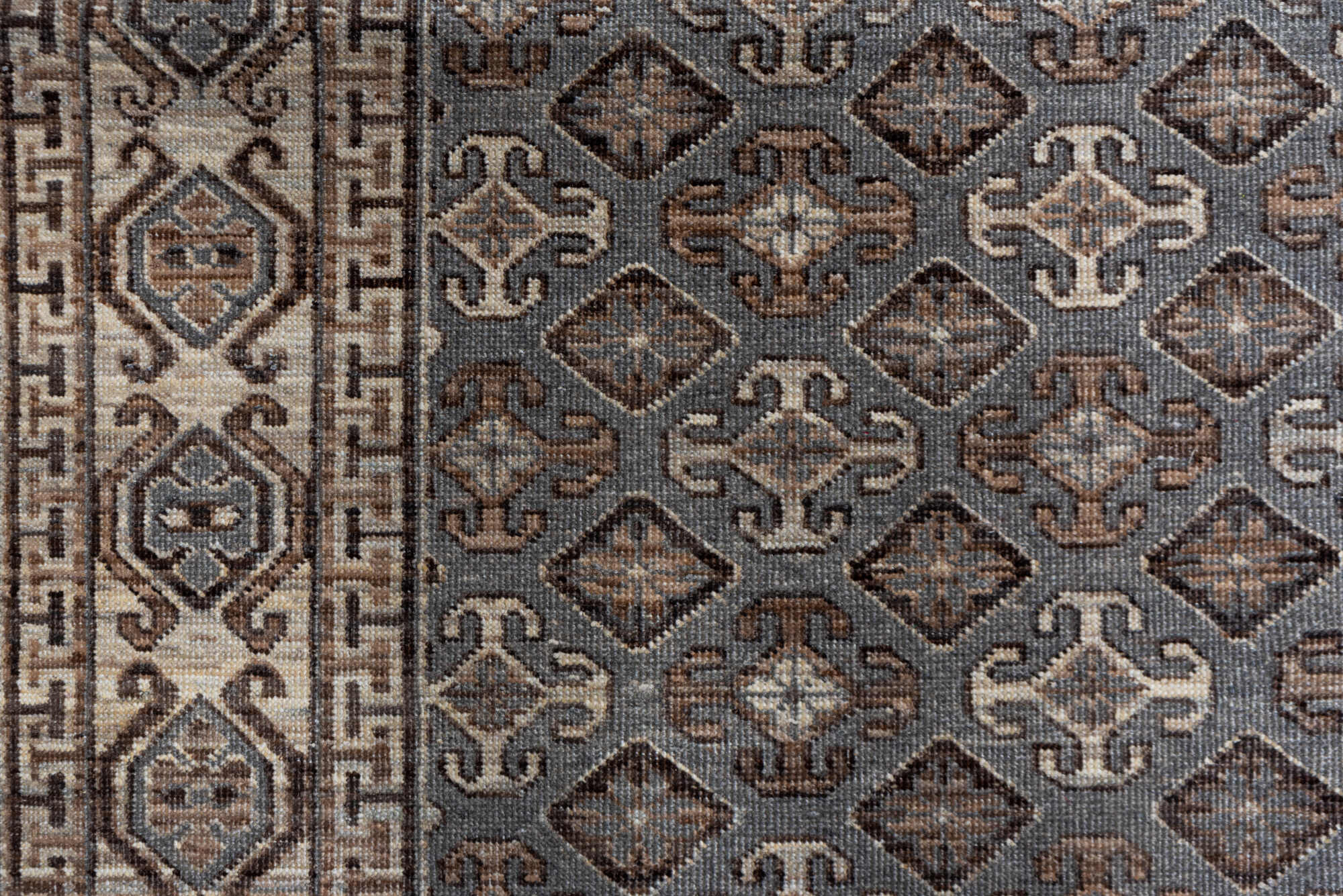 4' x 6' one-of-a-kind handmade vintage Khotan small size rug. Color palette: brown, dark gray, gray, light gray, off-white