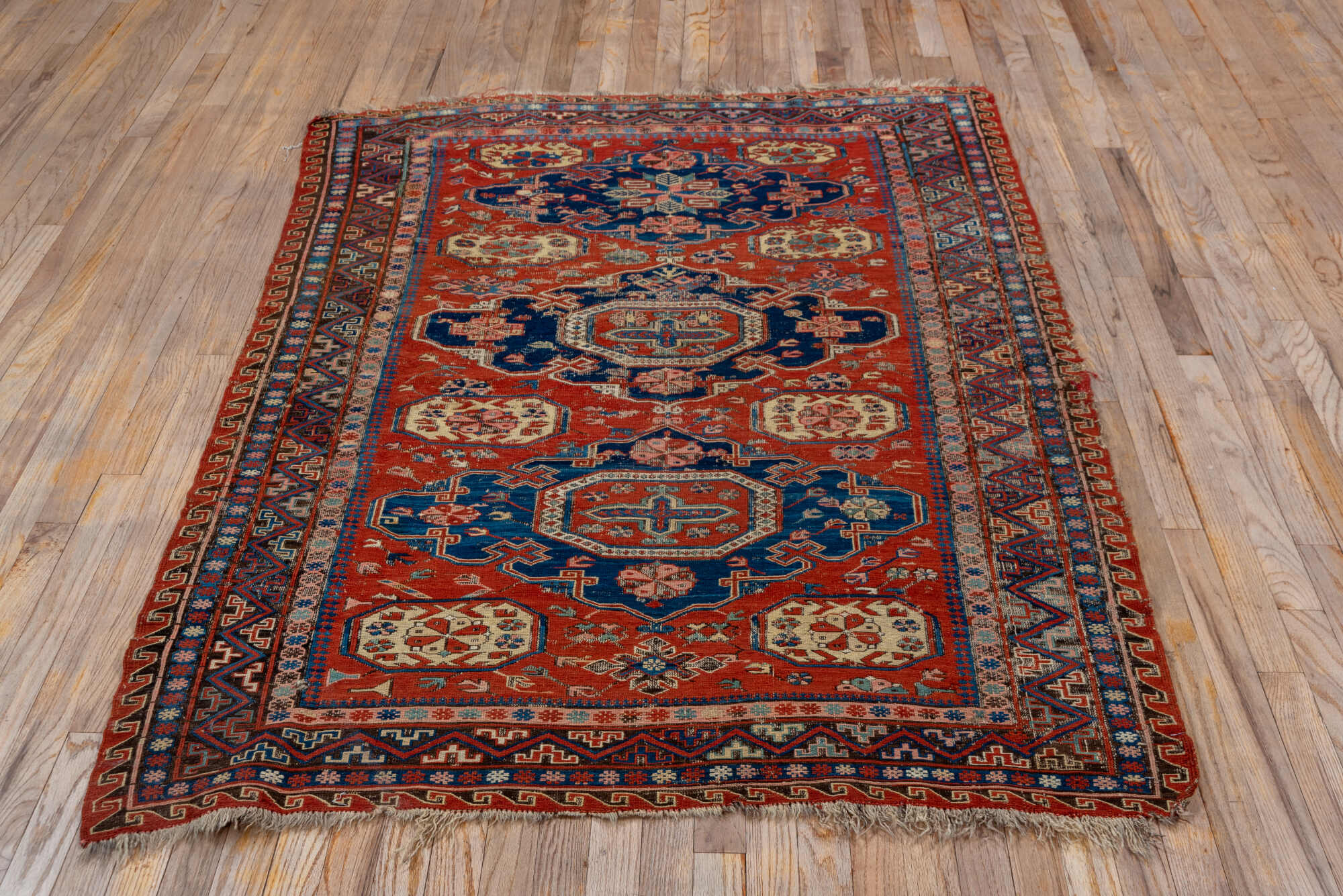 4' x 6' one-of-a-kind handmade vintage Sumak small size rug. Color palette: blue, brown, gray, light gray, pink, red