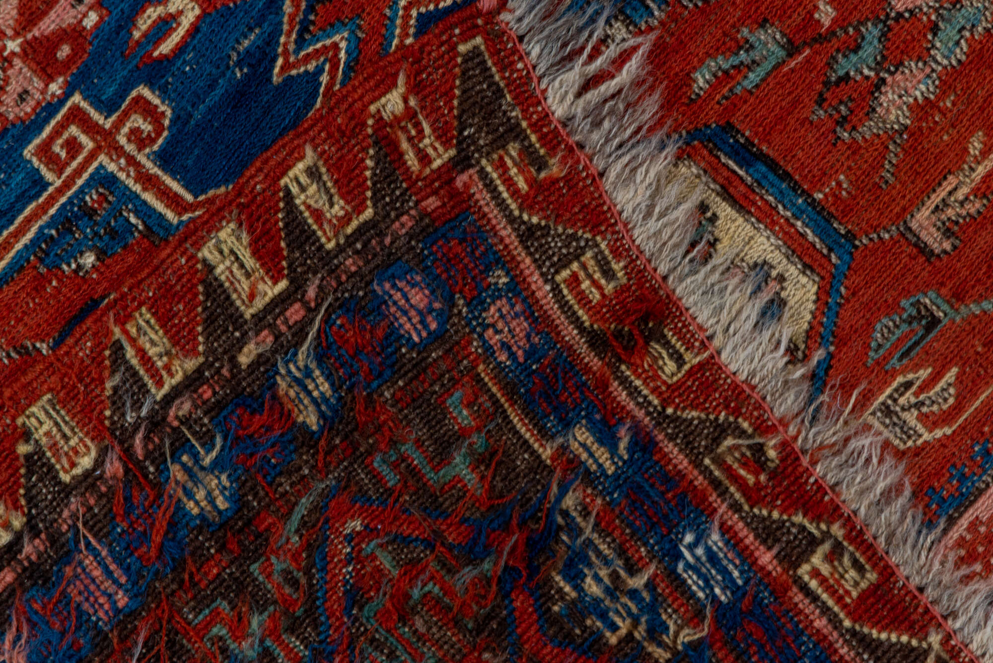 4' x 6' one-of-a-kind handmade vintage Sumak small size rug. Color palette: blue, brown, gray, light gray, pink, red