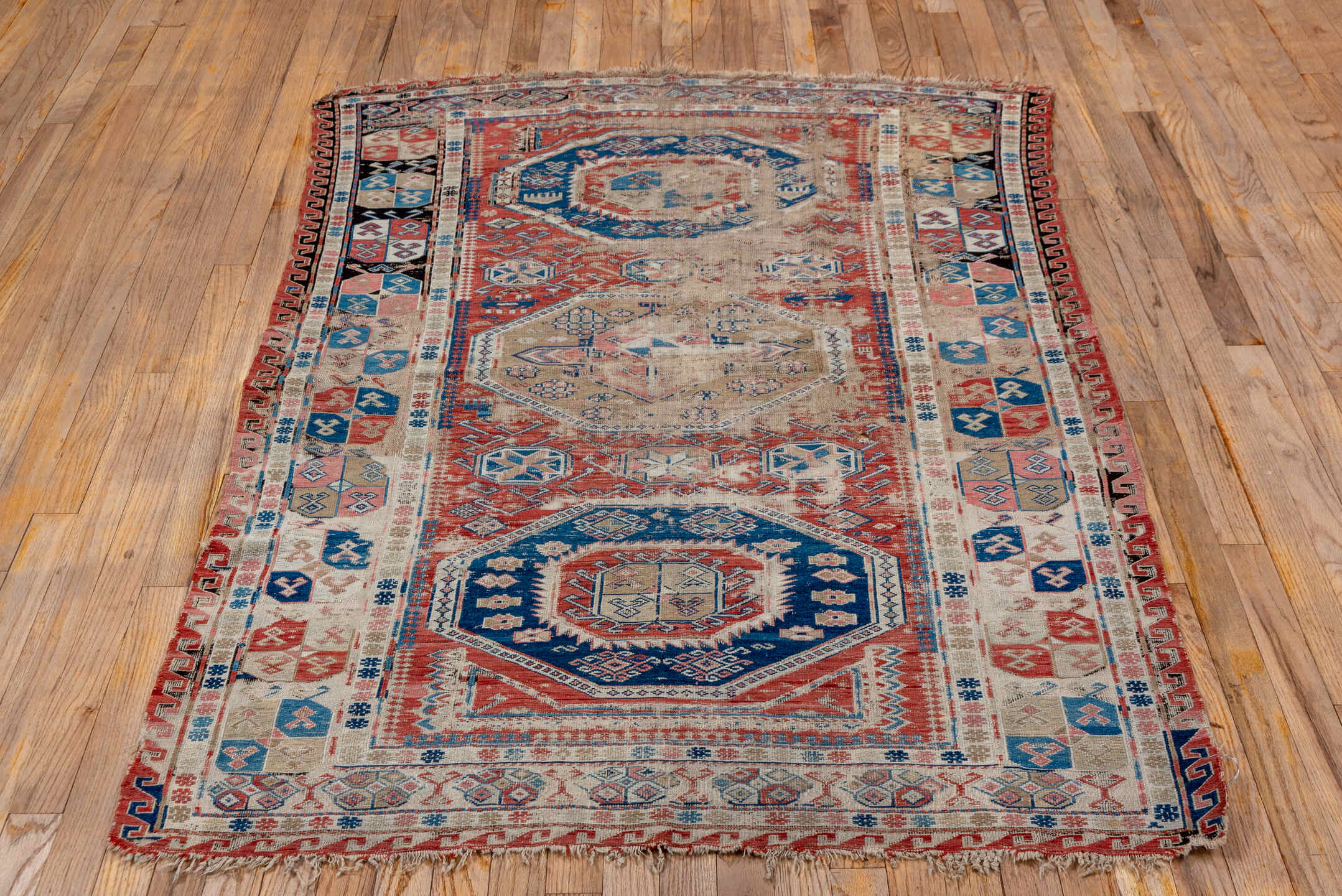 3' x 6' one-of-a-kind handmade vintage Sumak small size rug. Color palette: brown, gray, blue, pink, light gray, off-white