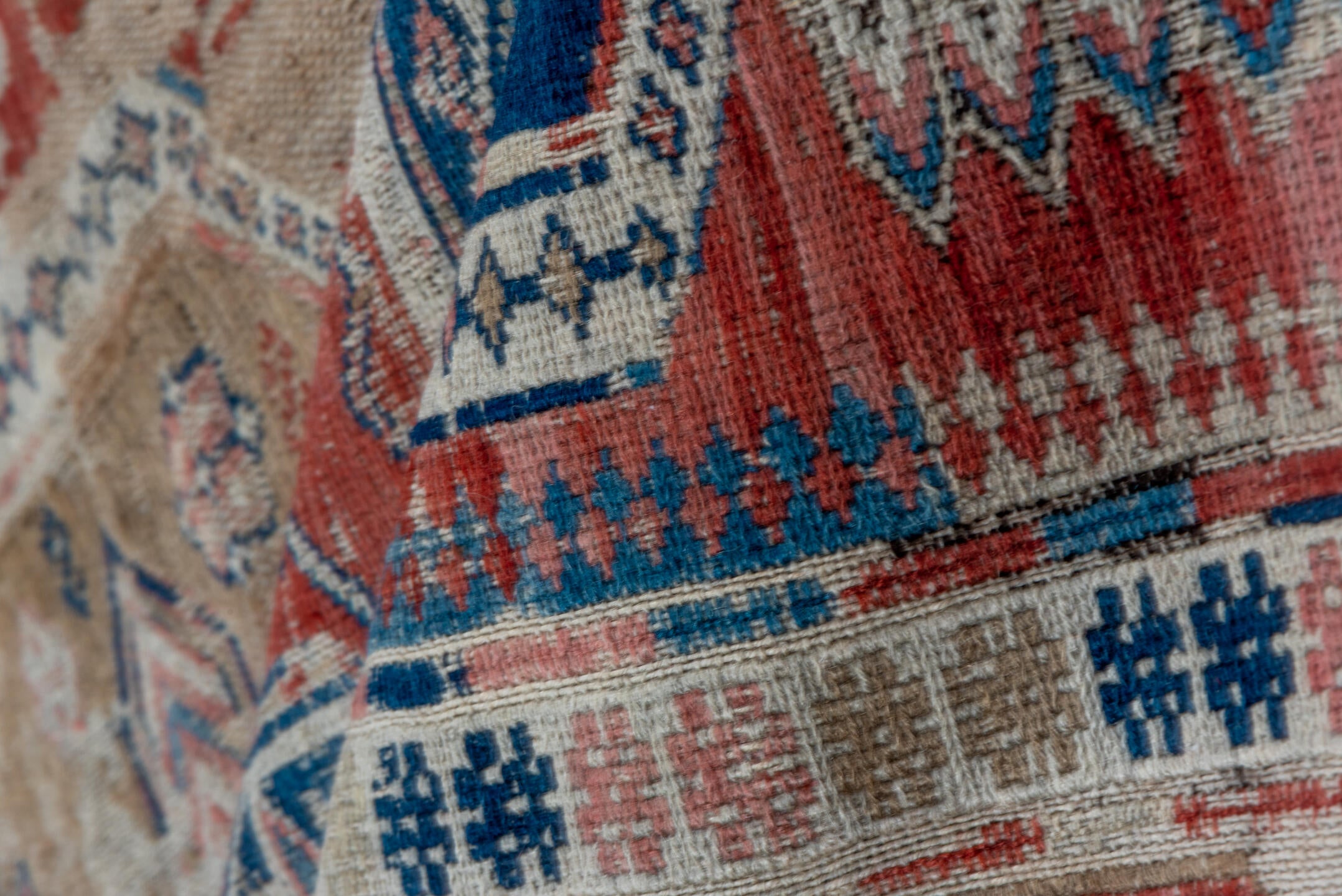 3' x 6' one-of-a-kind handmade vintage Sumak small size rug. Color palette: brown, gray, blue, pink, light gray, off-white