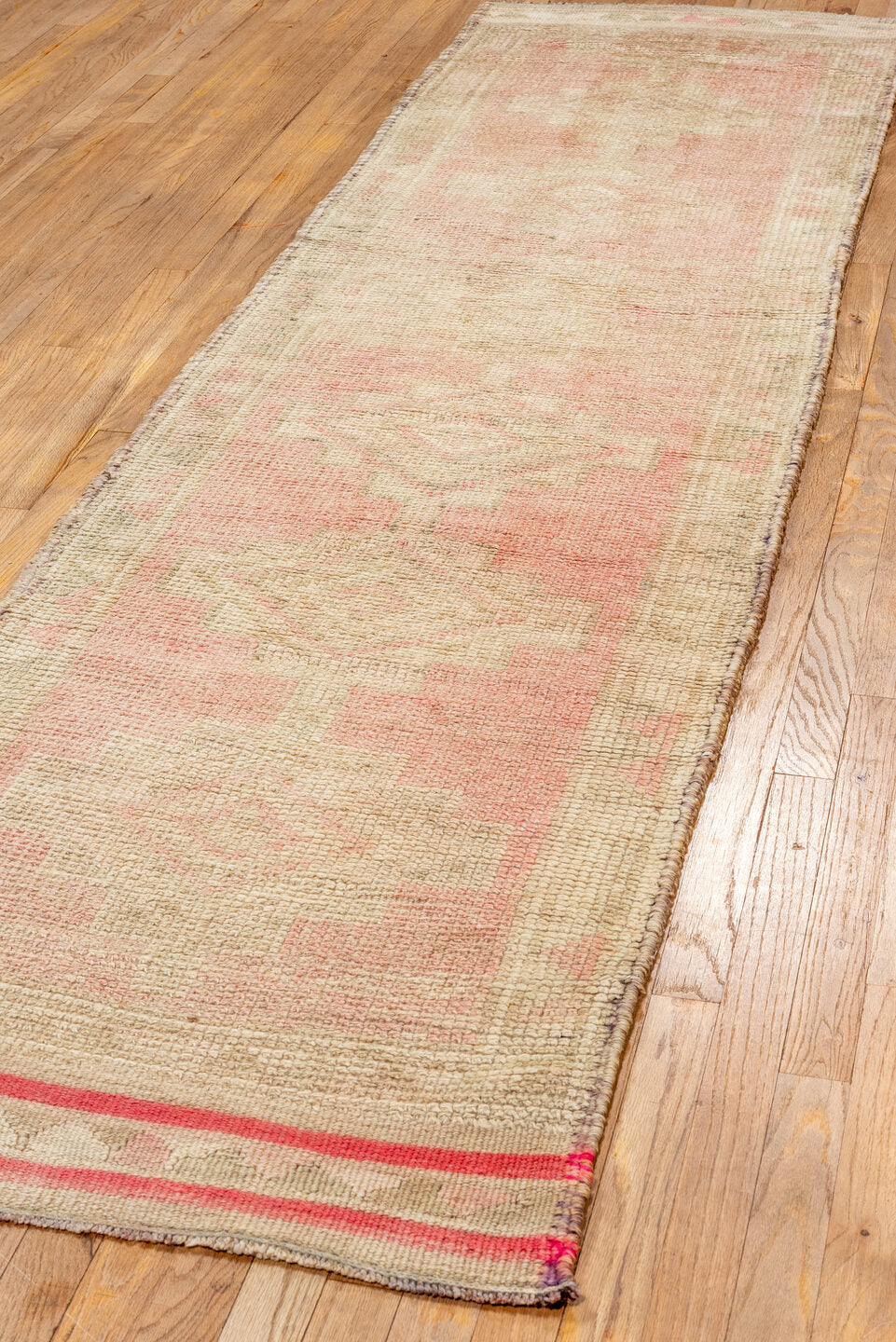 2' x 10' one-of-a-kind handmade vintage Kars runner rug. Color palette: orange, brown, off-white, pink, red, white, snow