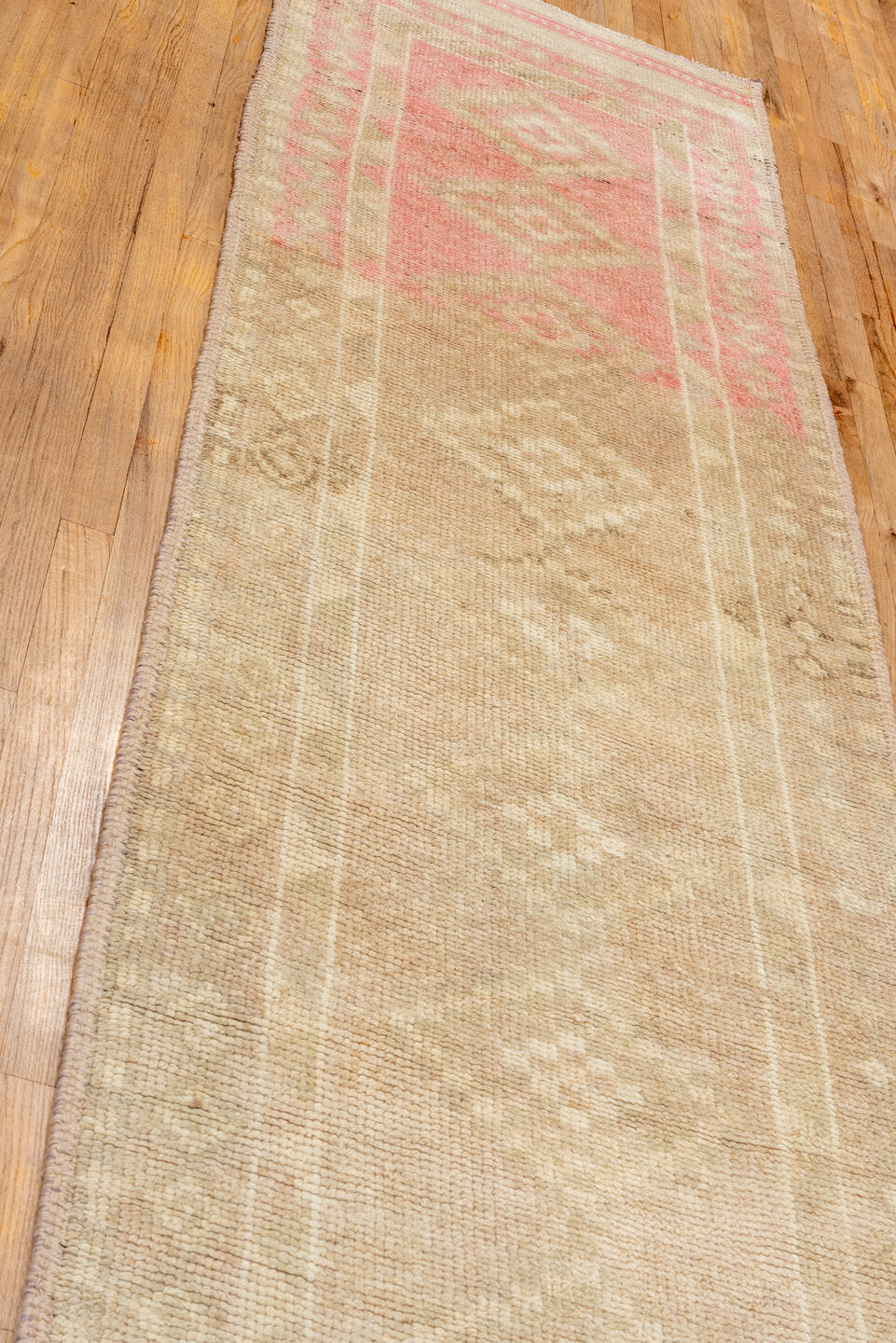 2' x 12' one-of-a-kind handmade vintage Kars runner rug. Color palette: pink, brown, off-white, orange, tan, bisque