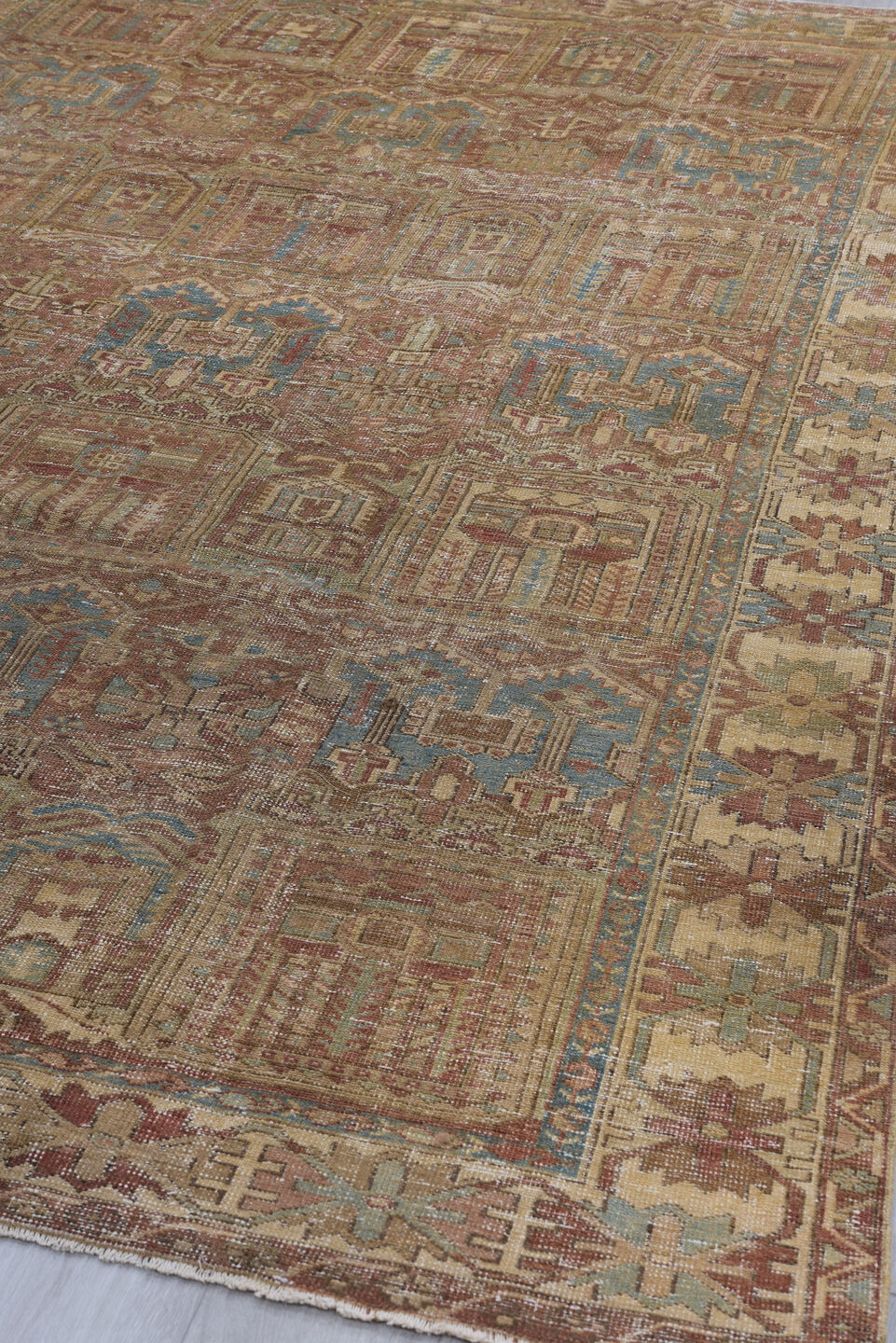 6' x 9' one-of-a-kind handmade vintage Baktiary medium size rug. Color palette: brown, gray, pink, light gray, off-white