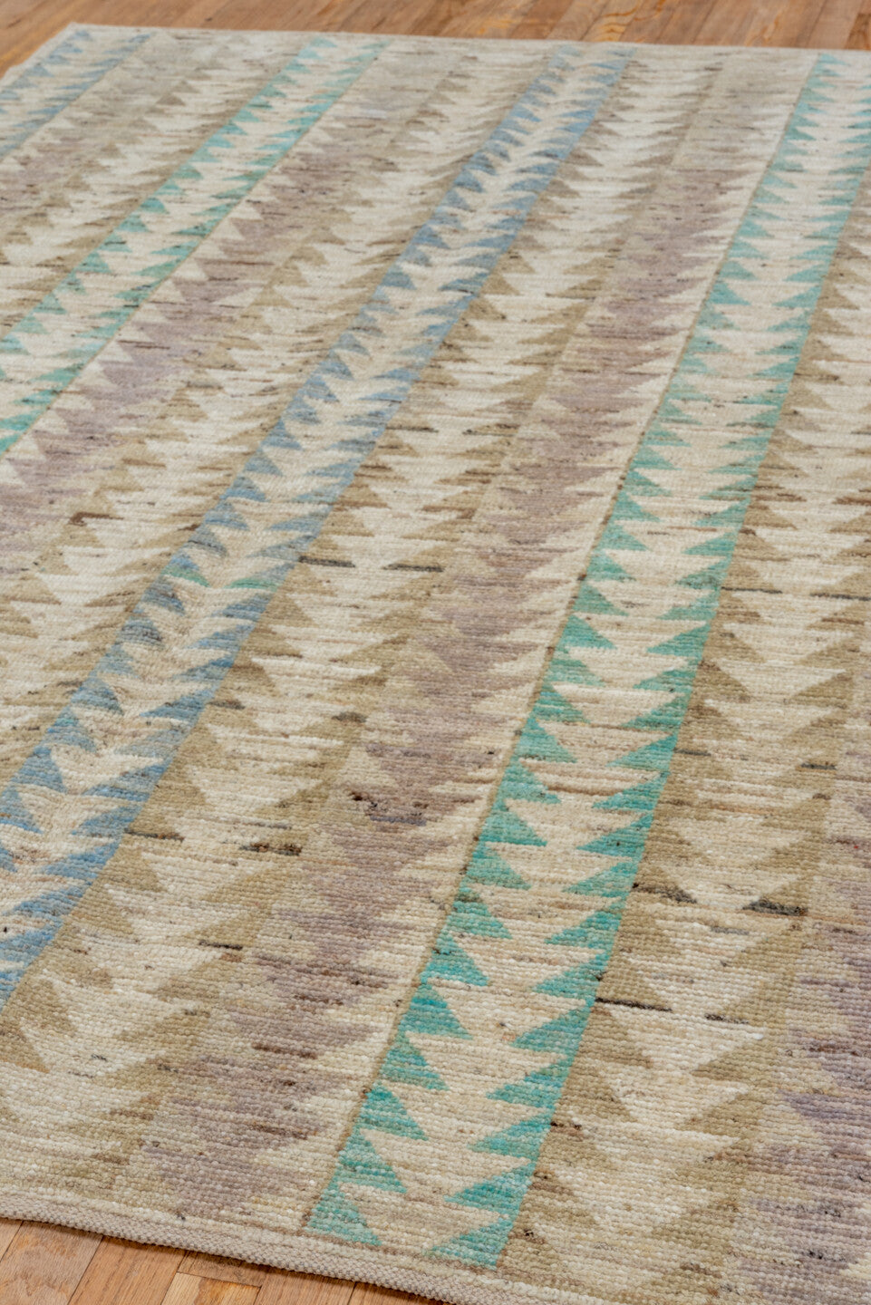 5' x 7' one-of-a-kind handmade vintage Moroccan rug. Color palette: gray, blue, light gray, off-white, green, brown, pink