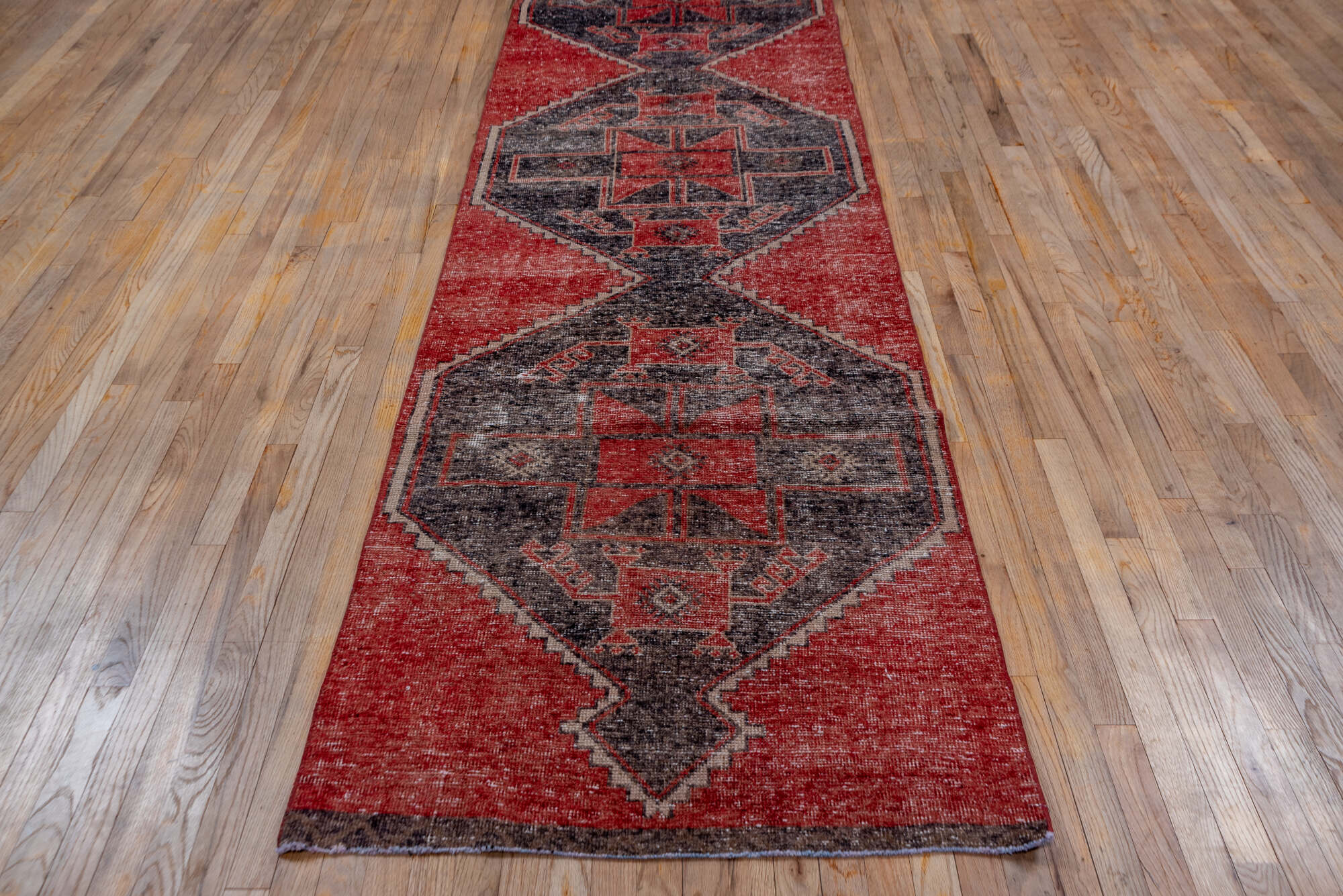 3' x 12' one-of-a-kind handmade vintage Oushak runner rug. Color palette: brown, gray, pink, red