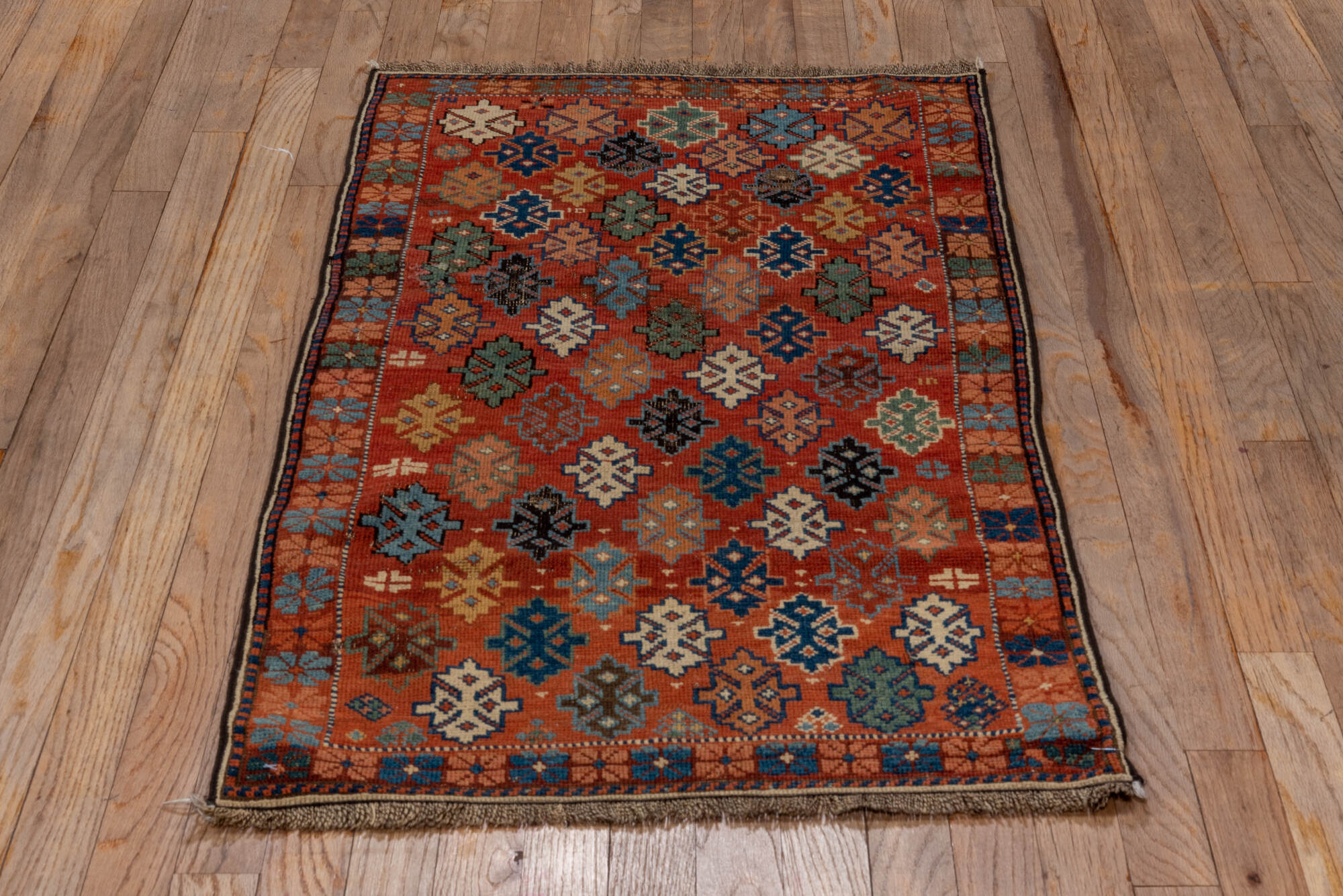 2' x 4' one-of-a-kind handmade vintage Shirvan small size rug. Color palette: black, brown, gray, pink, red