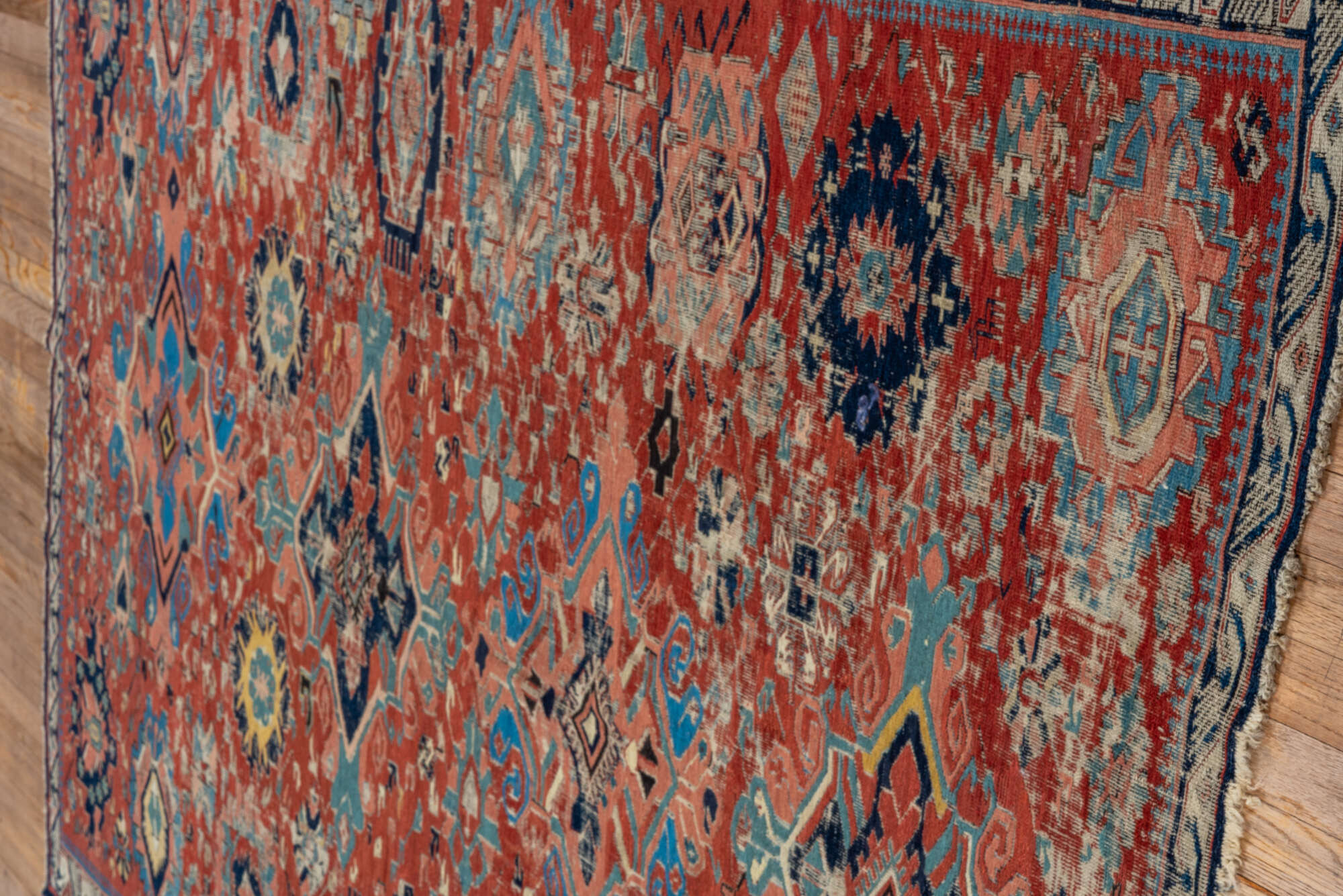 5' x 7' one-of-a-kind handmade vintage Sumak rug. Color palette: black, blue, brown, charcoal, dark gray, gray, pink, red