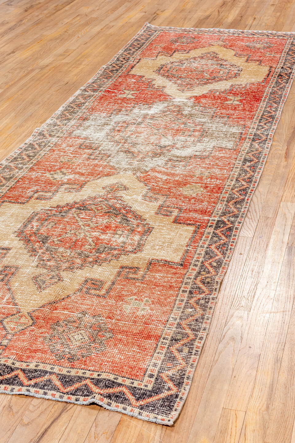 3' x 11' one-of-a-kind handmade vintage Oushak runner rug. Color palette: pink, brown, gray, off-white, red, orange