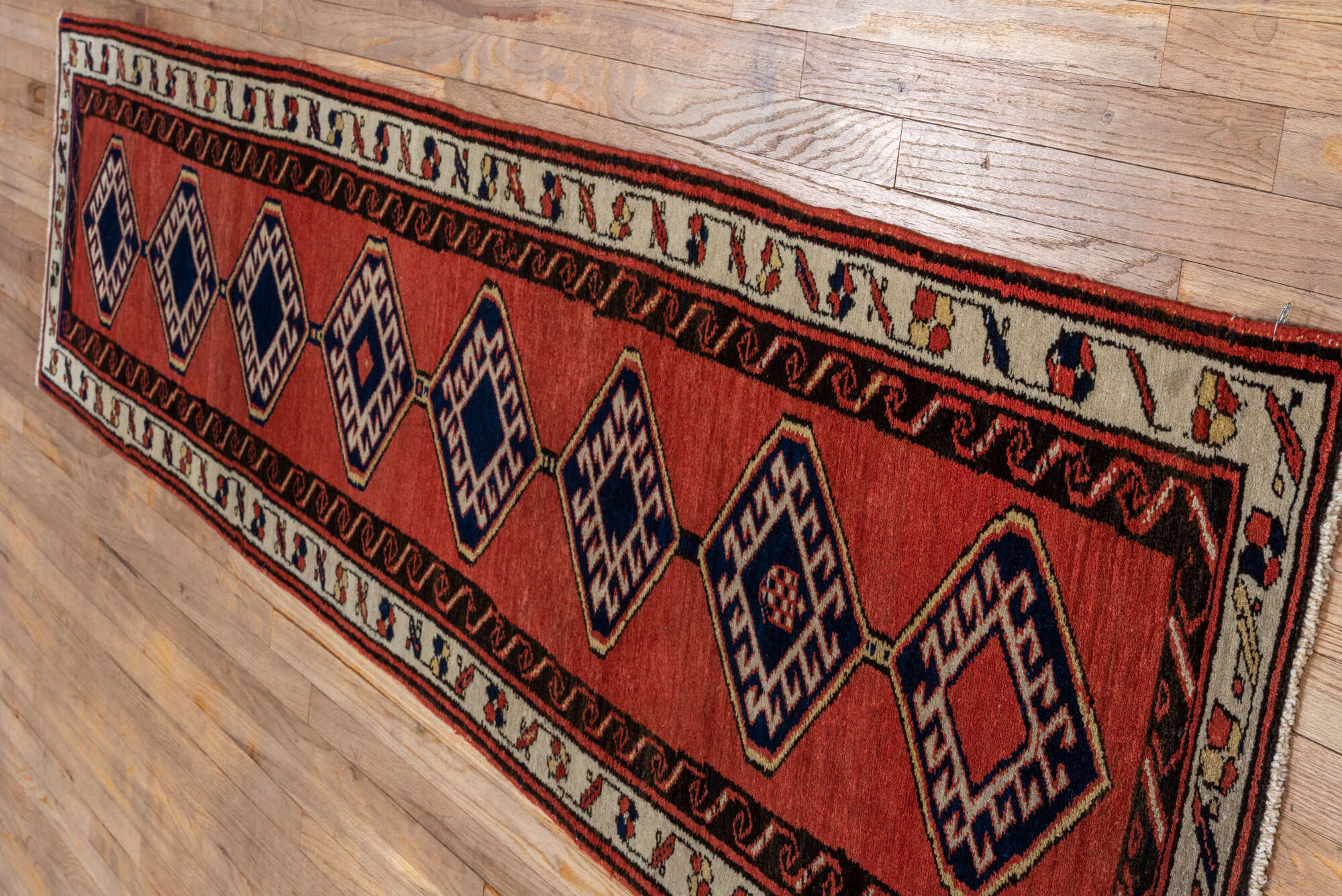 2' x 9' one-of-a-kind handmade vintage Sarab runner rug. Color palette: black, brown, gray, off-white, pink, red, snow