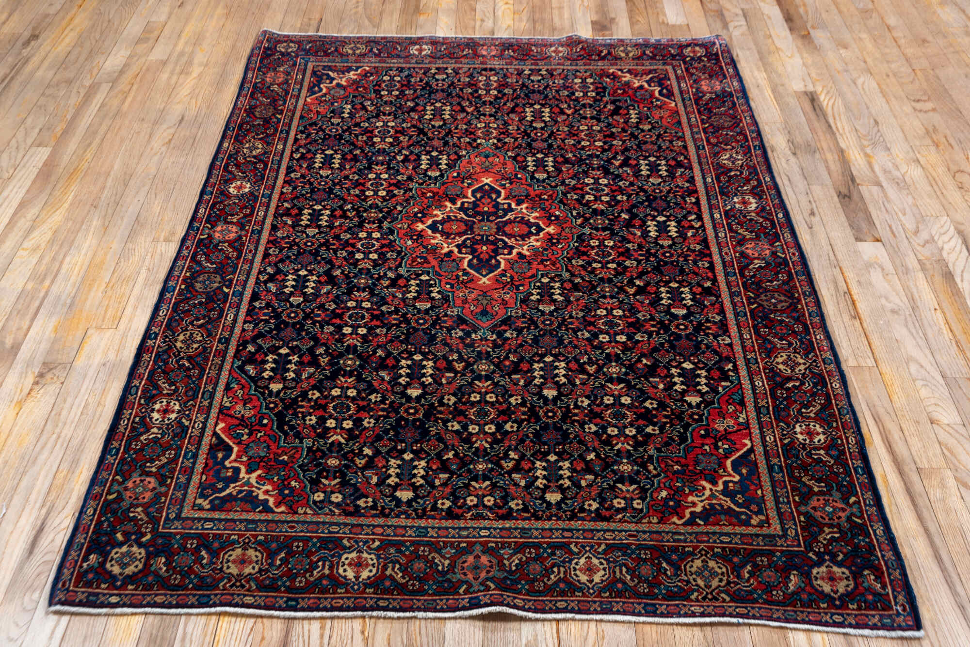 4' x 6' one-of-a-kind handmade vintage Meighan small size rug. Color palette: black, brown, gray, off-white, orange, pink