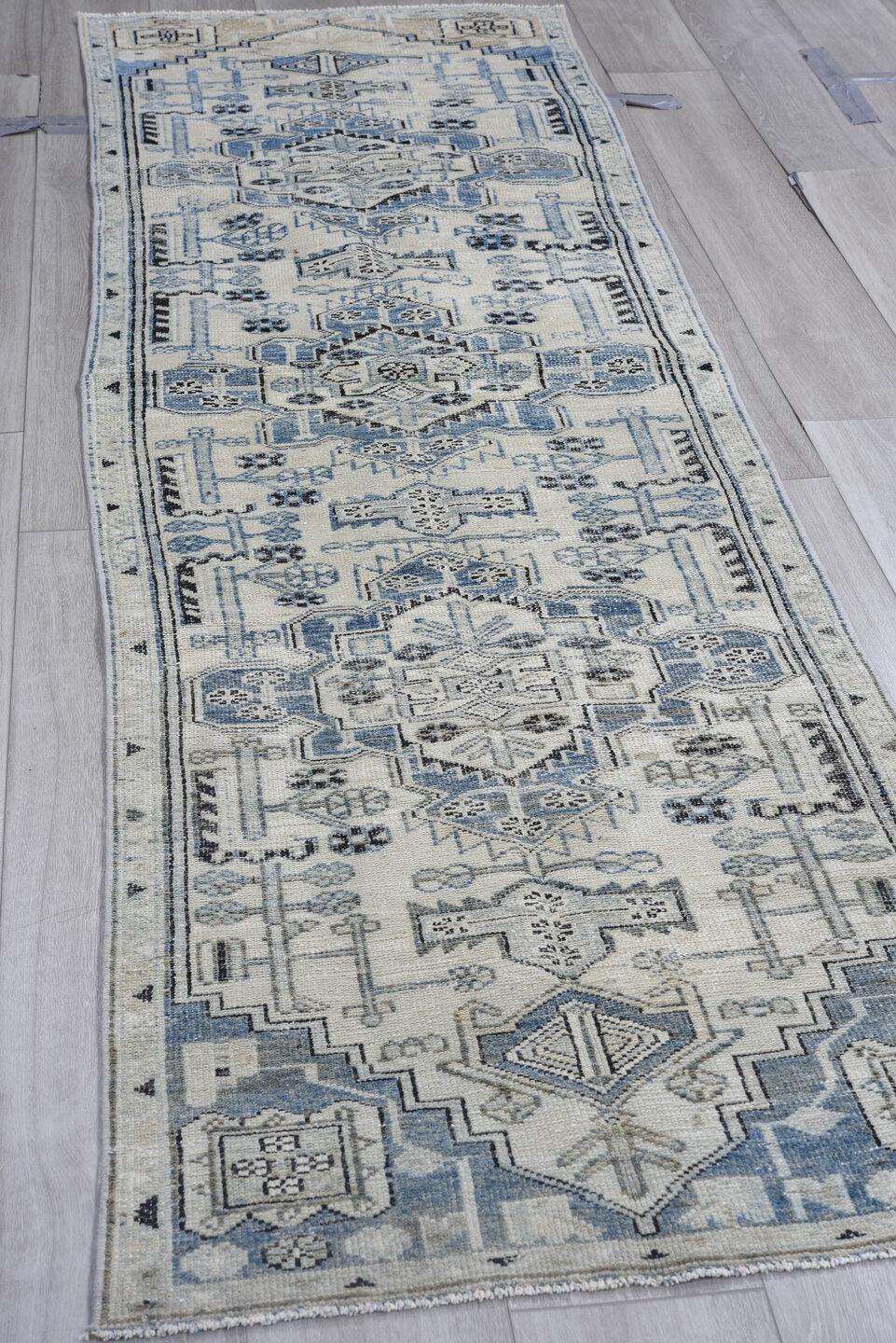 2' x 9' one-of-a-kind handmade vintage Karaje runner rug. Color palette: gray, light gray, off-white, black, blue, silver