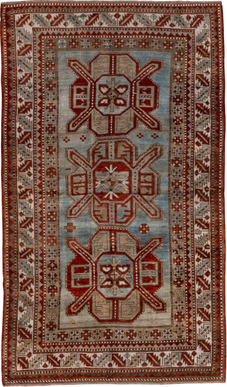 4' x 7' one-of-a-kind handmade vintage Kazak rug. Color palette: brown, gray, pink