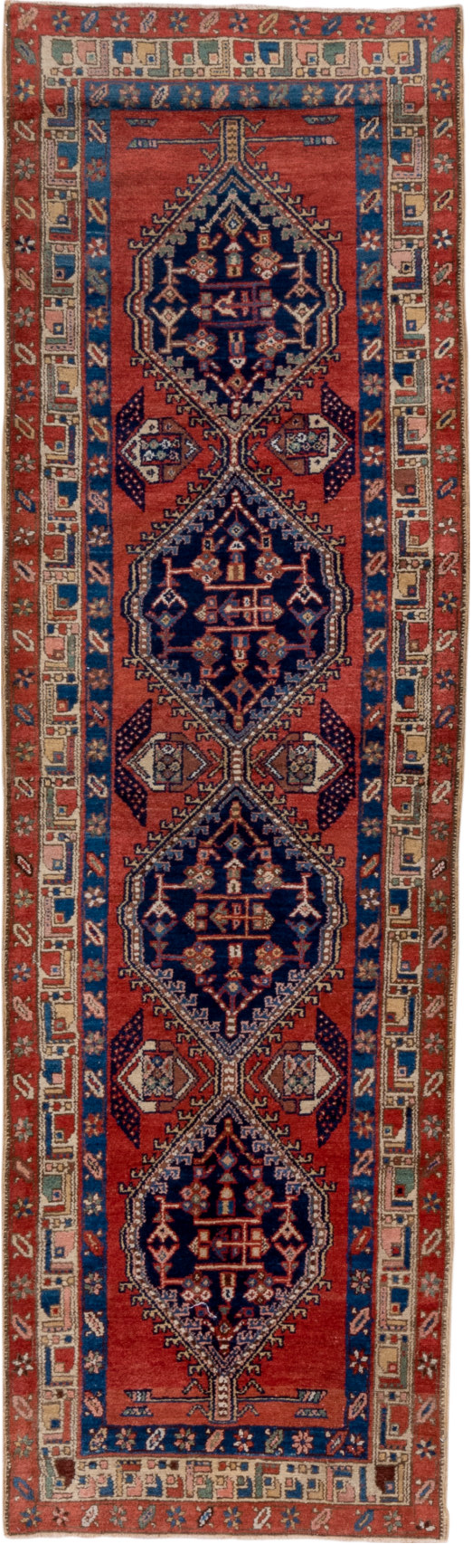 3' x 9' one-of-a-kind handmade vintage Heriz runner rug. Color palette: blue, brown, gray, maroon, pink, red, redwood