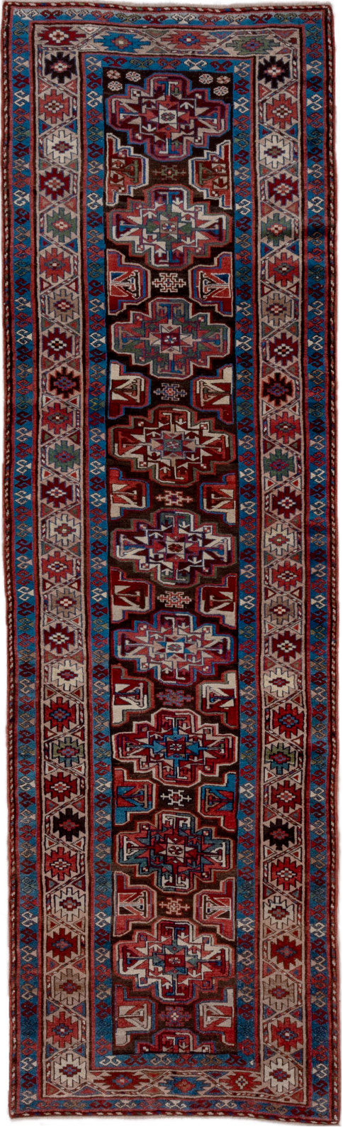 3' x 10' one-of-a-kind handmade vintage Kurd runner rug. Color palette: black, blue, brown, gray, pink, red