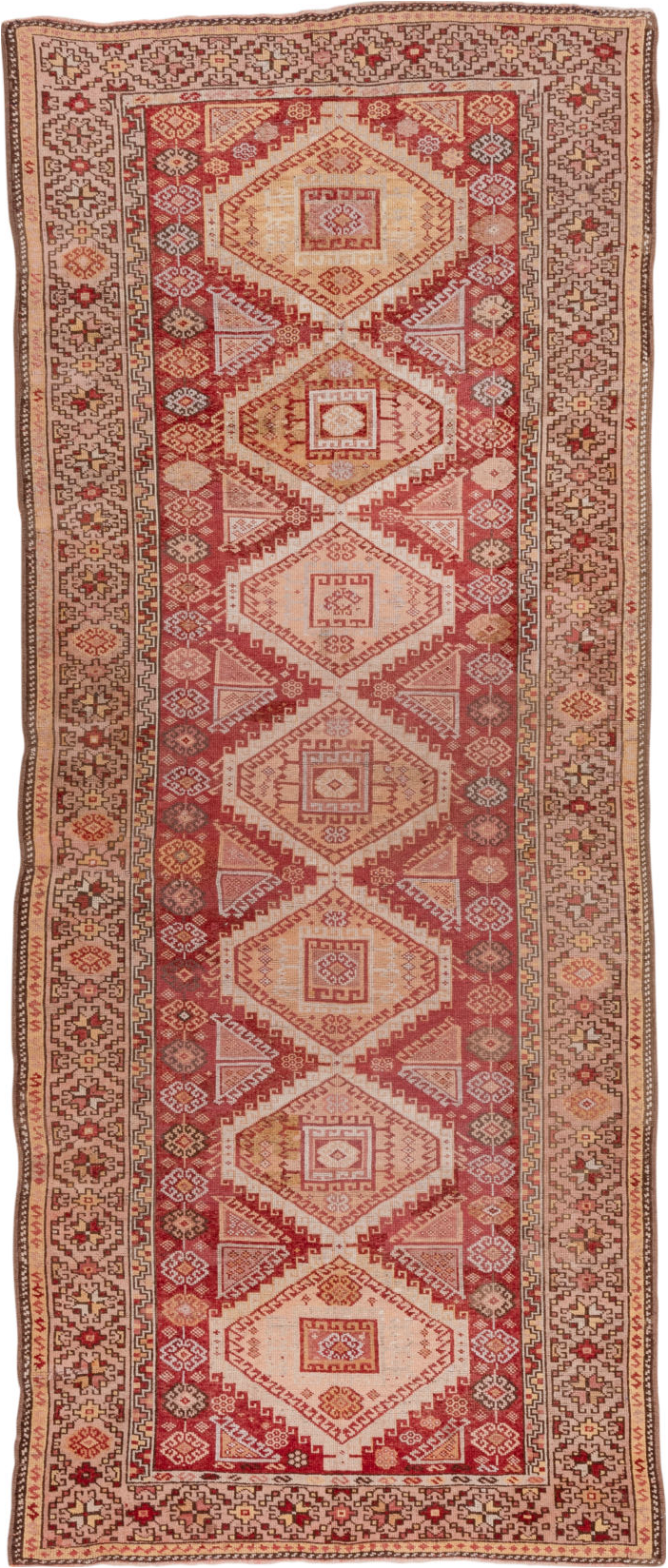 4' x 11' one-of-a-kind handmade vintage Kurd runner rug. Color palette: brown, pink, red