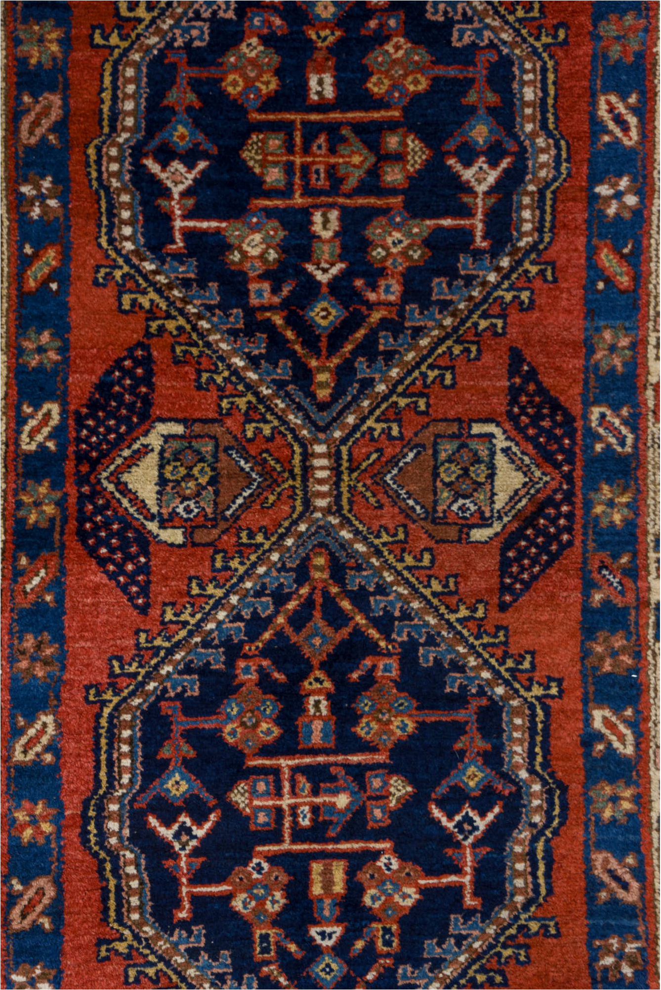 3' x 9' one-of-a-kind handmade vintage Heriz runner rug. Color palette: blue, brown, gray, maroon, pink, red, redwood