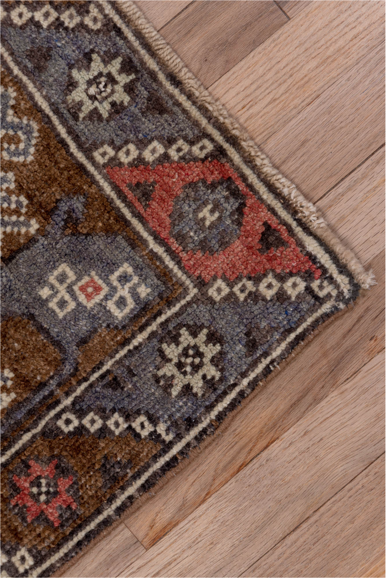 4' x 8' one-of-a-kind handmade vintage Konya runner rug. Color palette: brown, gray, pink, red