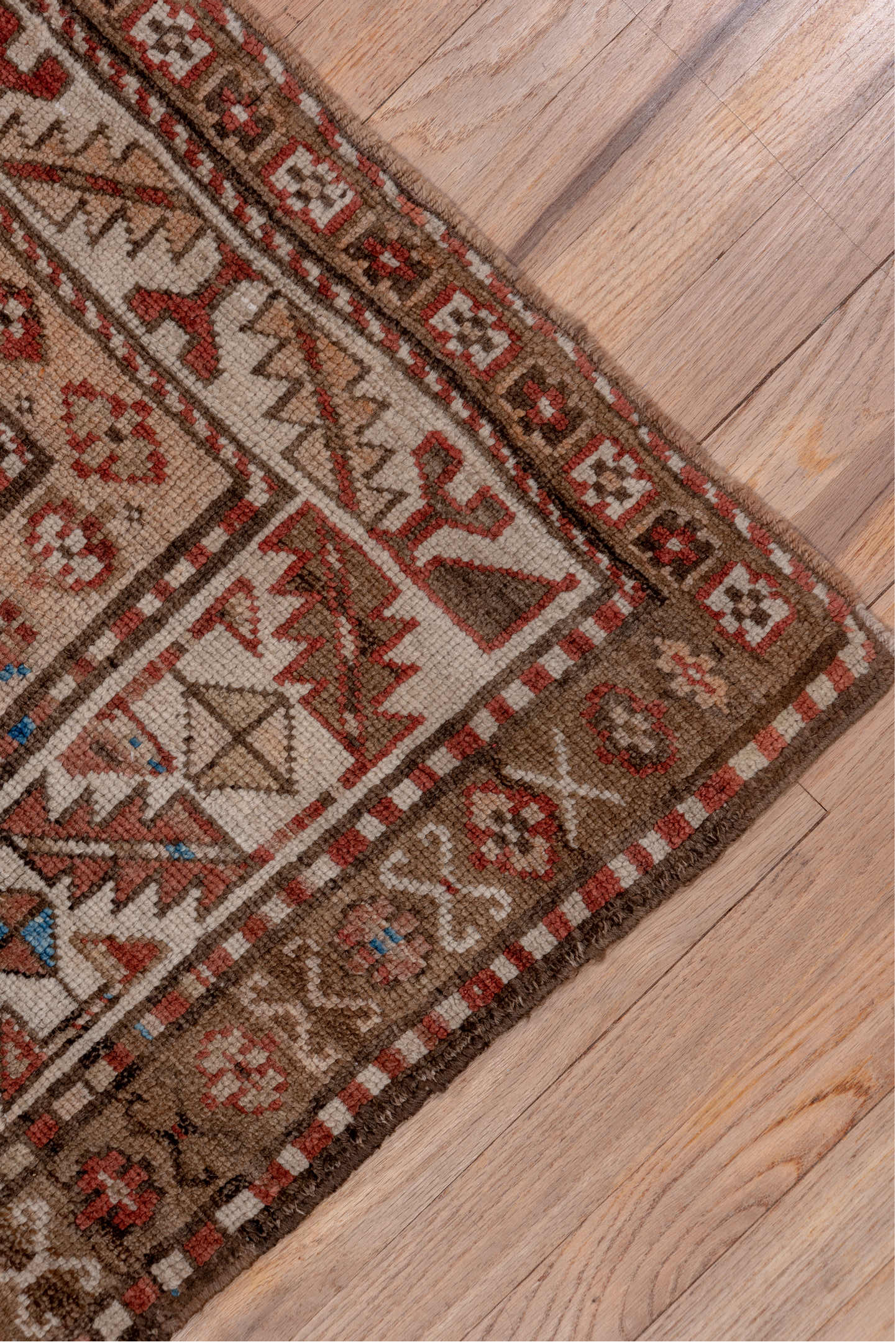 4' x 9' one-of-a-kind handmade vintage Kurd runner rug. Color palette: brown, gray, blue, pink, light gray, arapawa