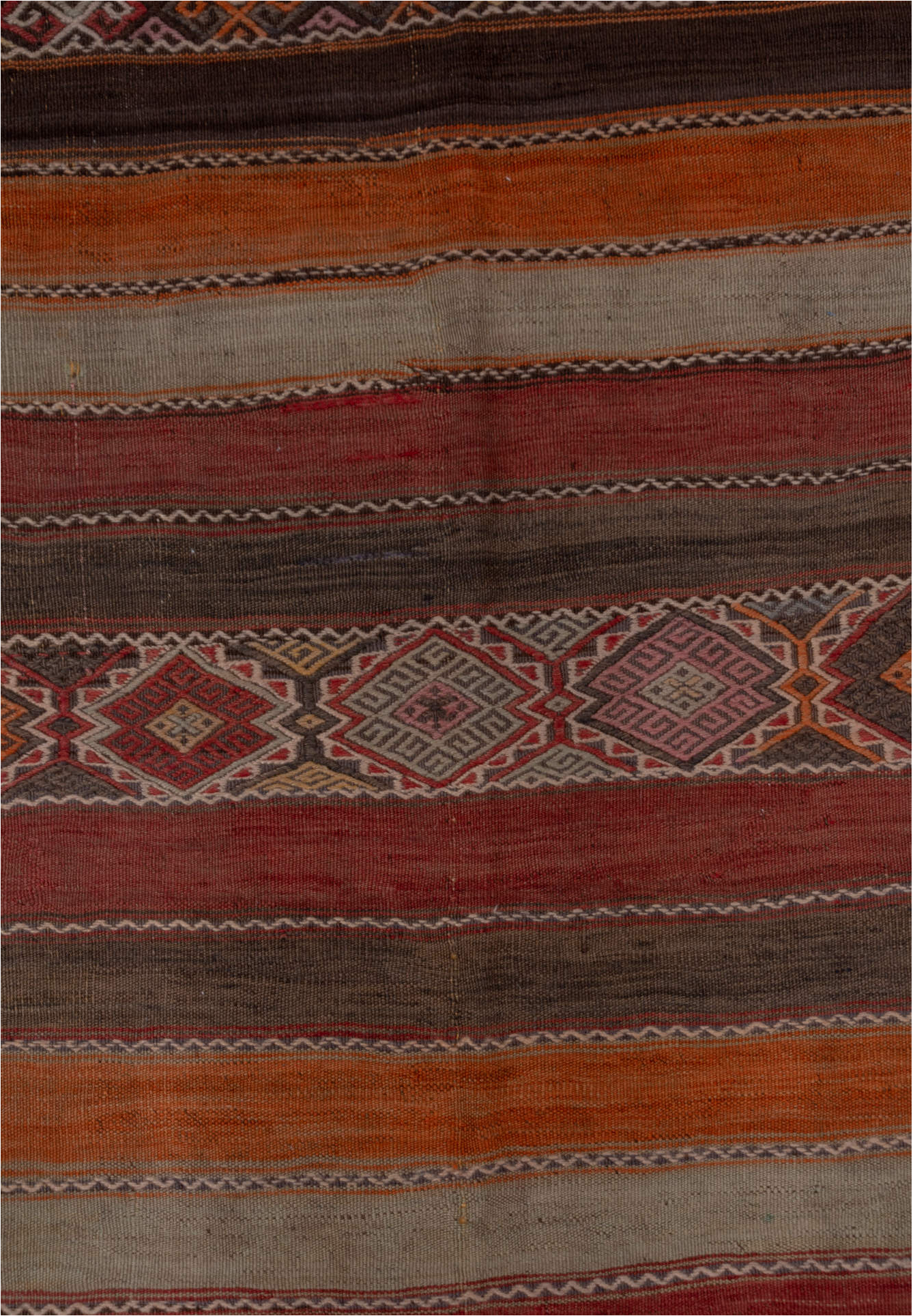 4' x 10' one-of-a-kind handmade vintage Jijim runner rug. Color palette: brown, gray, pink, red, redwood