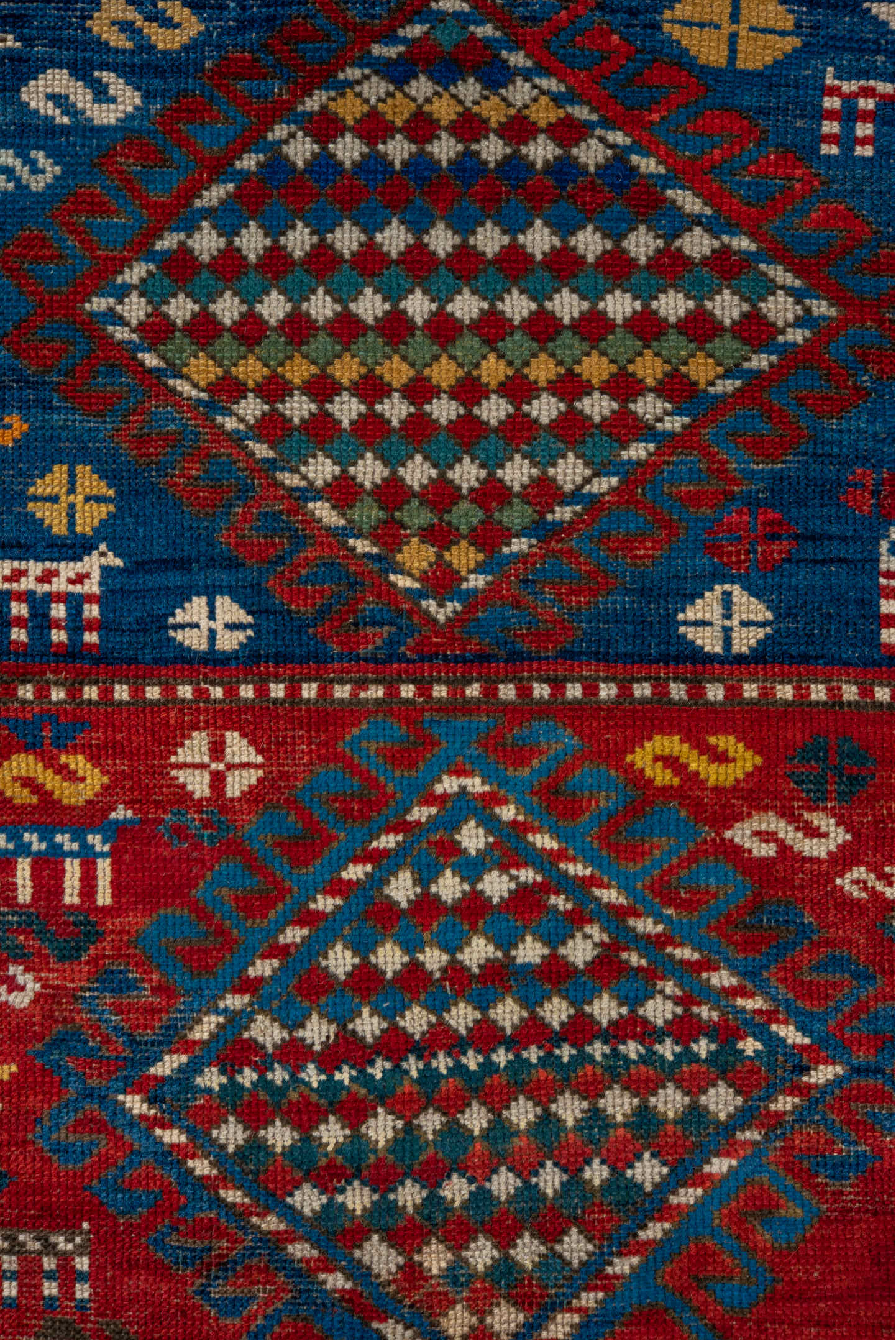 3' x 5' one-of-a-kind handmade vintage Caucasian small size rug. Color palette: gray, blue, brown, red, pink