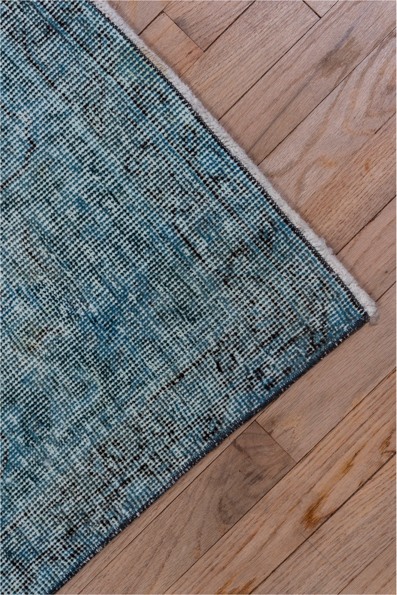 4' x 12' one-of-a-kind handmade vintage Overdyed runner rug. Color palette: arapawa, black, blue, gray, light blue