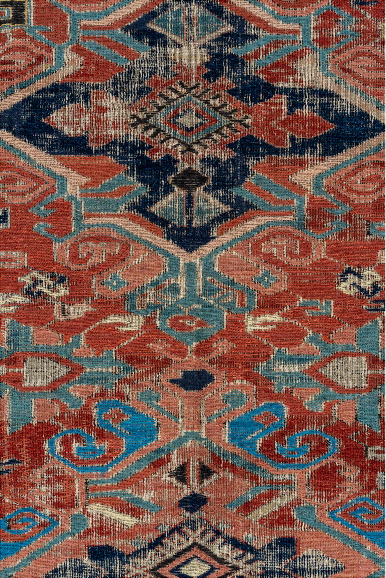 5' x 7' one-of-a-kind handmade vintage Sumak rug. Color palette: black, blue, brown, charcoal, dark gray, gray, pink, red