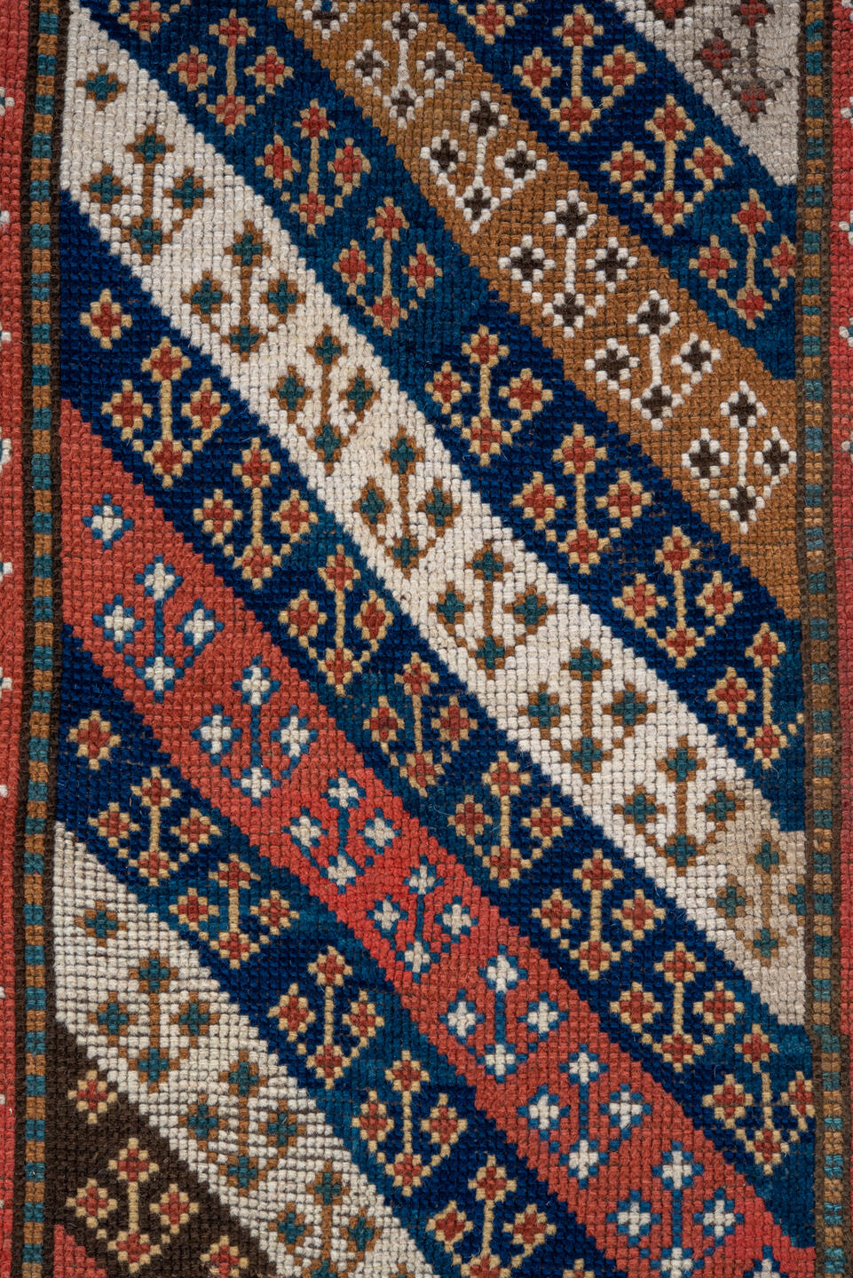 3' x 6' one-of-a-kind handmade vintage Kazak small size rug. Color palette: brown, gray, blue, red, pink, redwood