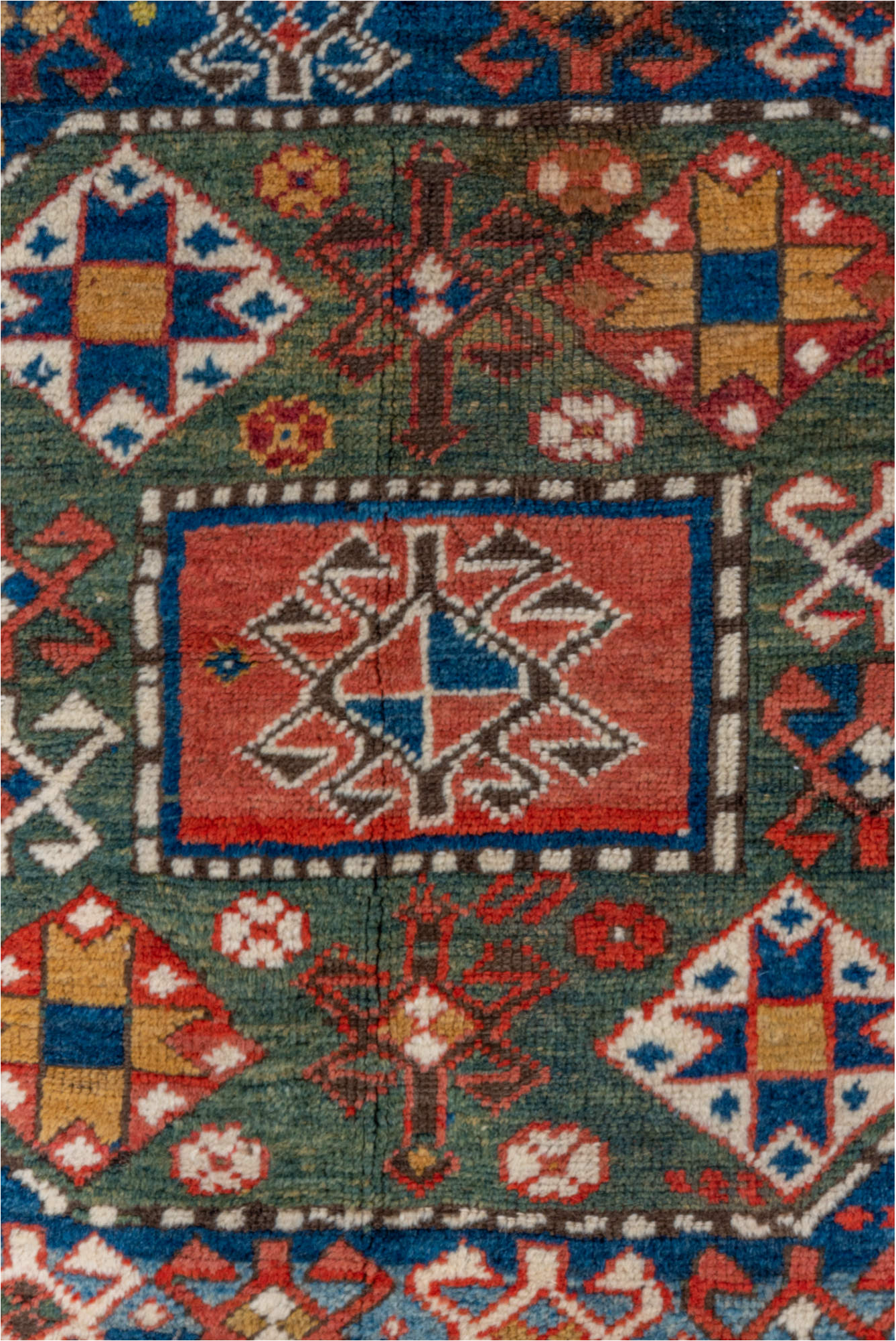4' x 6' one-of-a-kind handmade vintage Kazak small size rug. Color palette: blue, brown, gray, pink, red